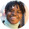 Black man smiling at camera close up