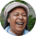 Happy african senior woman laughing in front
