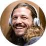 Portrait of laughing man listening music with head